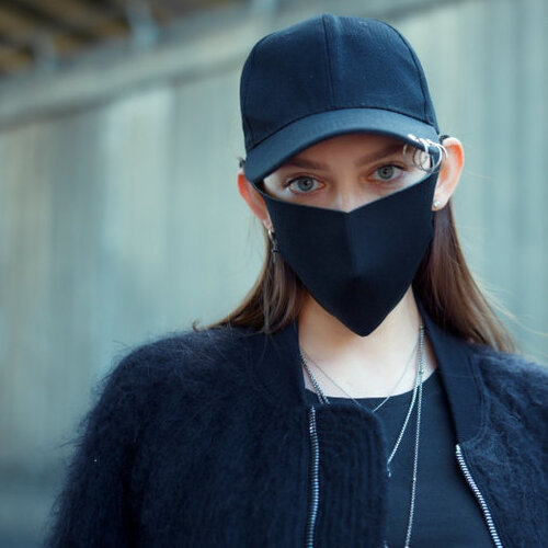 protester with a mask covering her face