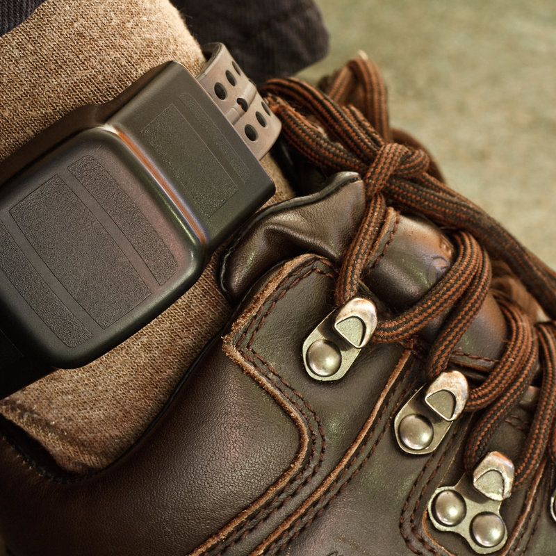 close-up of an individual wearing an ankle bracelet