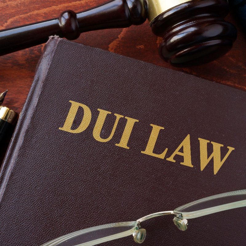 a leather-bound legal book titled DUI LAW