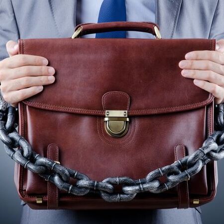 bail bonds represented through briefcase and chain