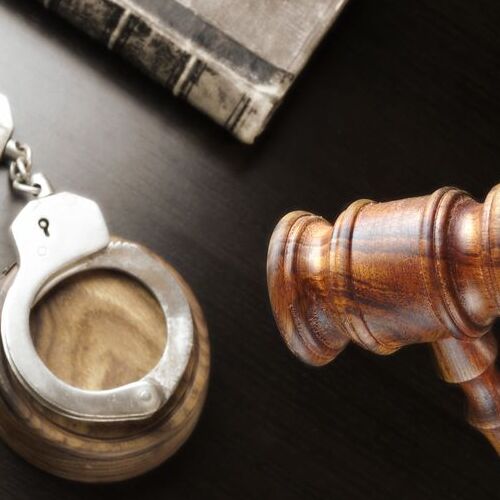 misdemeanor bail represented by handcuffs, gavel, and book