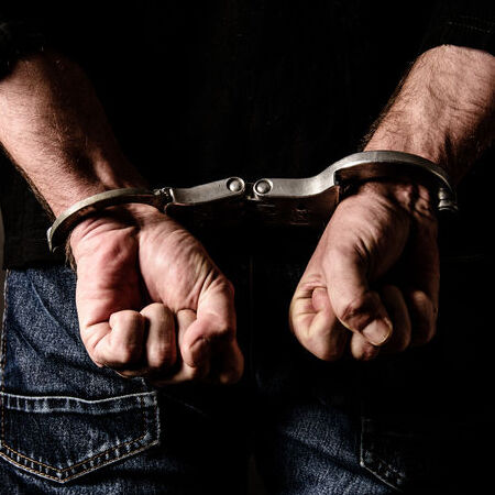 Man in handcuffs who needs bail bond