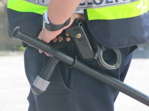 Photo of cop, police, baton, cuffs